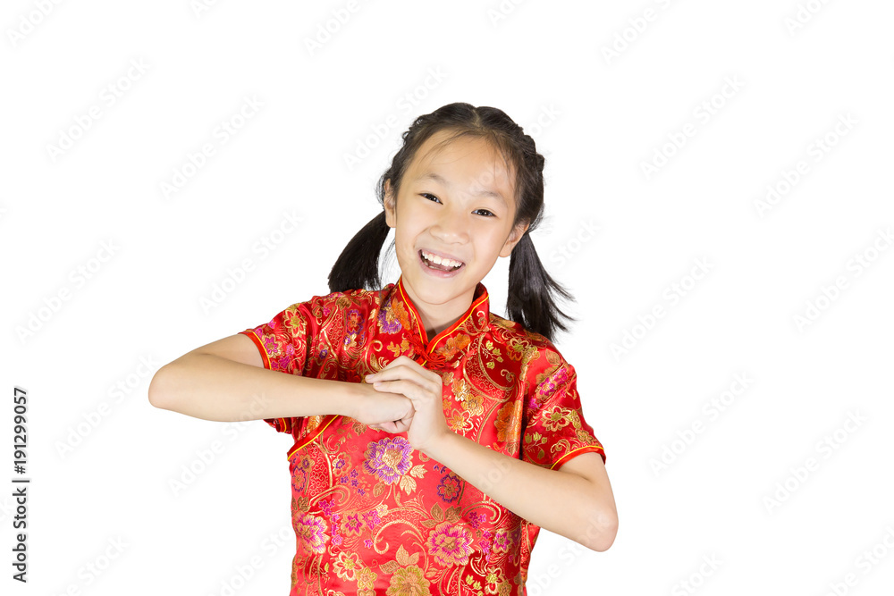 Asian girl wearing red Chinese suit on white background during traditional chinese new year festival,girl with congratulation gesture Asian girl wearing red Chinese suit on white background during traditional chinese new year festival,girl with congratulation gesture
