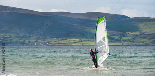 wind surfer in the ocean near the Dingle peninsula on the west coat of Ireland