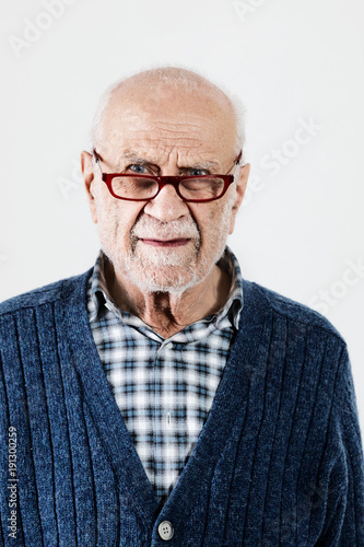 Portrait of senior man on a white background