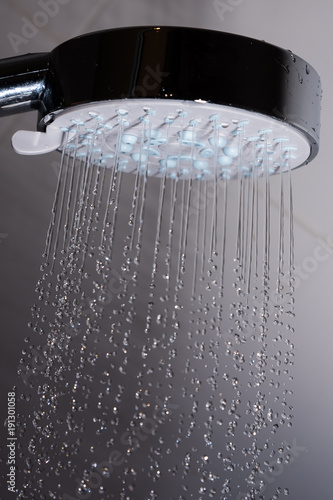 Shower head and flowing water. © Janis Smits