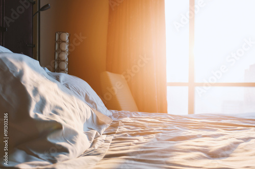 фотографія morning sunshine in the bedroom with soft-focus and over light in the background