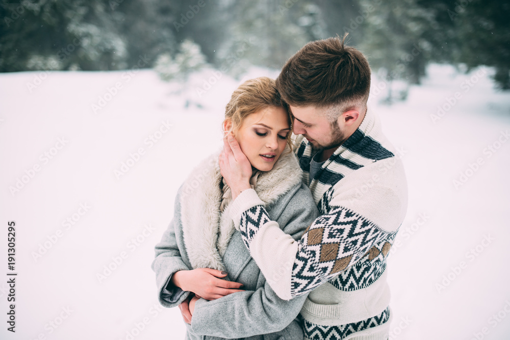 Fototapeta premium Photo of happy man and woman outdoor in winter