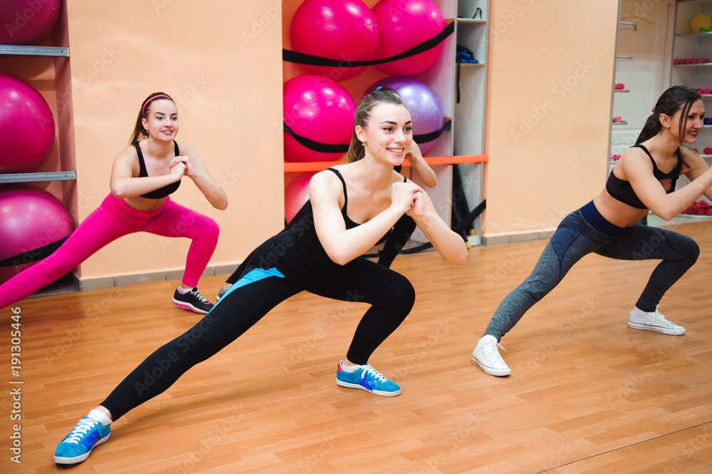 fitness, sport, training, gym and lifestyle concept - group of smiling people doing aerobic