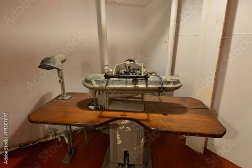 A vintage steam press on an American warship.  