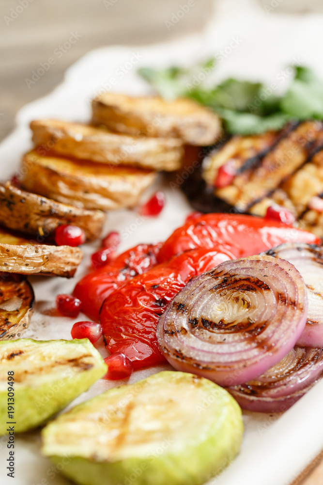 grilled vegetables. Serving on a wooden Board on a rustic table. Barbecue restaurant menu, a series of photos of different dishes grilled vegetables. Serving on a wooden Board on a rustic table. Barbecue restaurant menu, a series of photos of different dishes