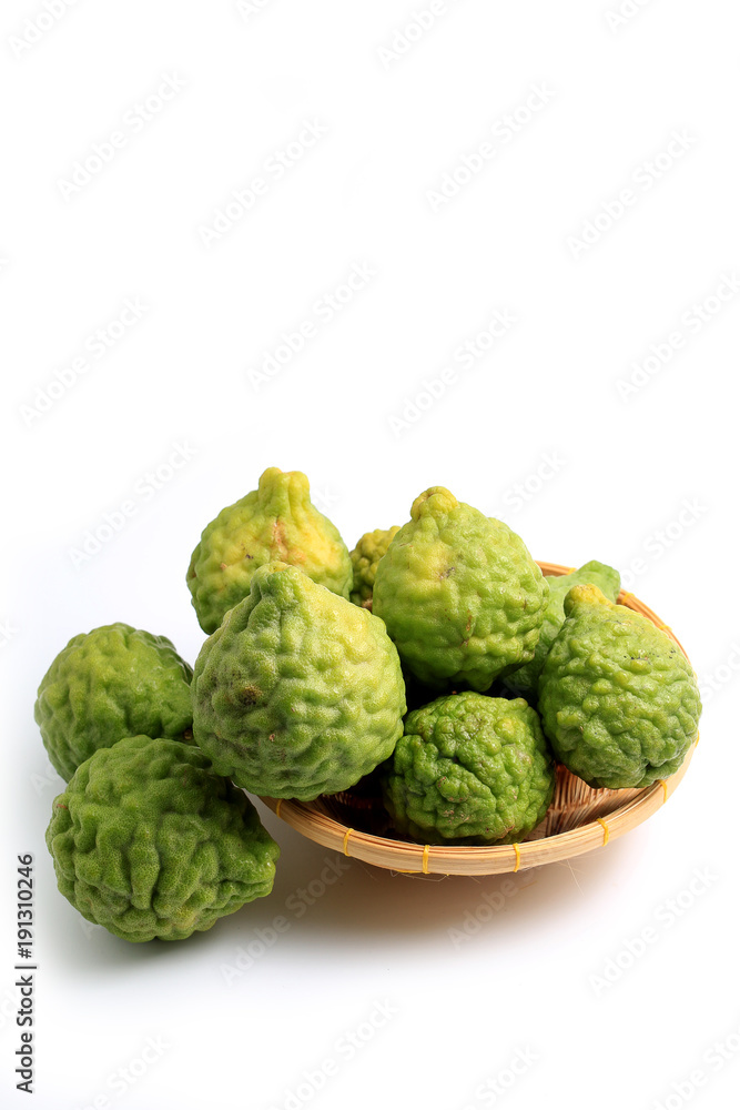 fresh bergamot fruit or the kaffir lime leaves in bamboo basket isolated on white background fresh bergamot fruit or the kaffir lime leaves in bamboo basket isolated on white background