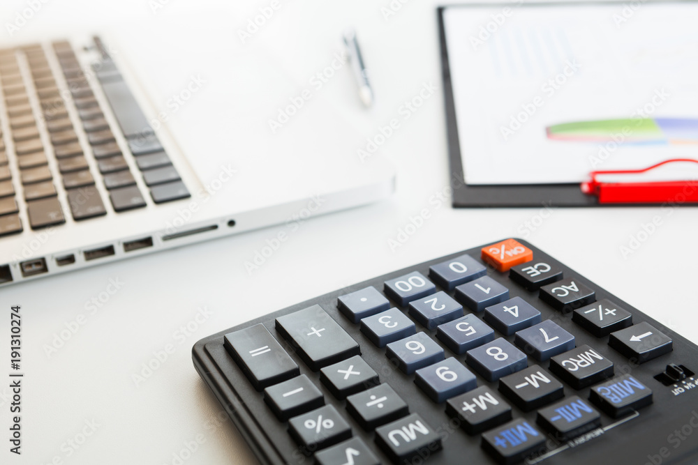 Close up view of bookkeeper or financial inspector hands making report, calculating or checking balance. Marketing strategy brainstorming. Paperwork and digital in office. Close up view of bookkeeper or financial inspector hands making report, calculating or checking balance. Marketing strategy brainstorming. Paperwork and digital in office.