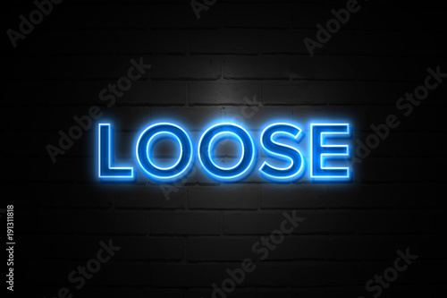 Loose neon Sign on brickwall