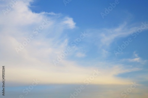 Beautiful blue sky with white and colorful cloud with sunlight in the evening. Soft focus. Nature background concept.