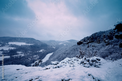 Winter landscape, forest and mountains during the snowfall, winter dream and winter fairytale