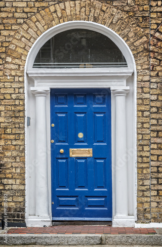 Blue classic door in Dublin, example of georgian typical architecture of Dublin, Ireland © Delphotostock