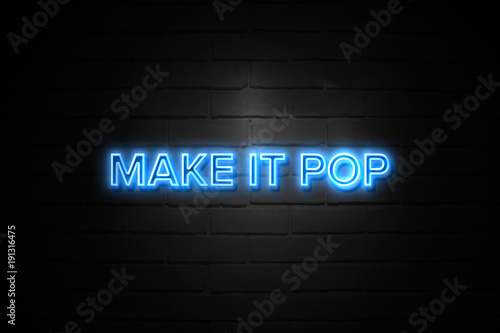 Make It Pop neon Sign on brickwall