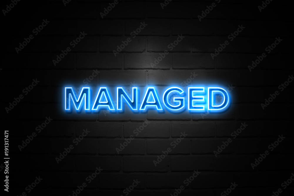 Managed neon Sign on brickwall