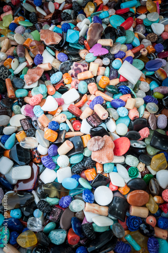 Background of hard polished stones with hole for inserting a necklace for sale Background of hard polished stones with hole for inserting a necklace for sale