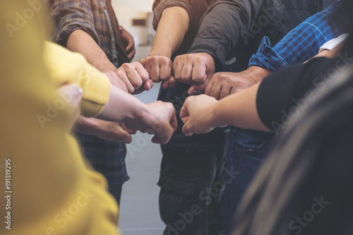 Quadro su tela Group of business team work join their hands together with power and successful