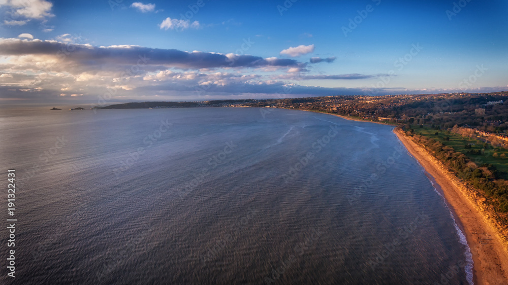 A view of the Swansea Bay, the gateway to the Gower peninsula, the UK's first Area of Outstanding Natural Beauty as it sweeps West from the University to Mumbles pier and lighthouse. A view of the Swansea Bay, the gateway to the Gower peninsula, the UK's first Area of Outstanding Natural Beauty as it sweeps West from the University to Mumbles pier and lighthouse.