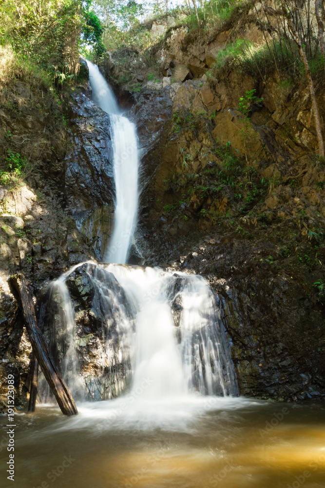 Fototapeta premium Scenic view on Mae Yen Waterfall with white water on a sunny day. Pai, Thailand.
