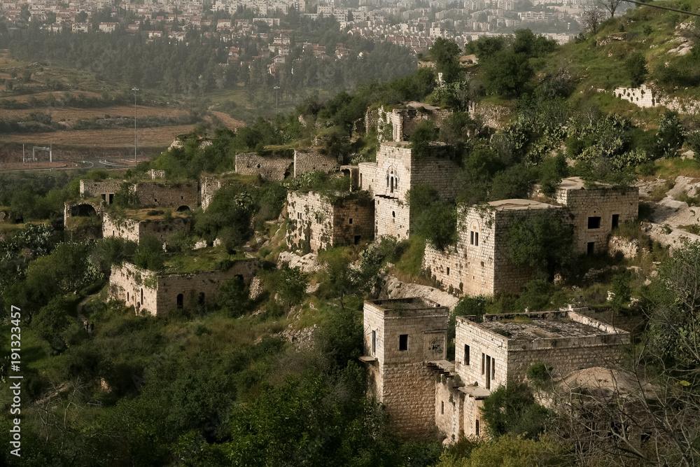 A view of abandoned village of Lifta on the outskirts of Jerusalem, in the background a view of Ramot neighborhood  in Jerusalem