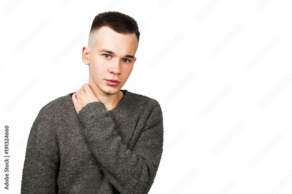 Portrait of white yong guy in gray sweater and short haircut, isolated on white. Portrait of white yong guy in gray sweater and short haircut, isolated on white.