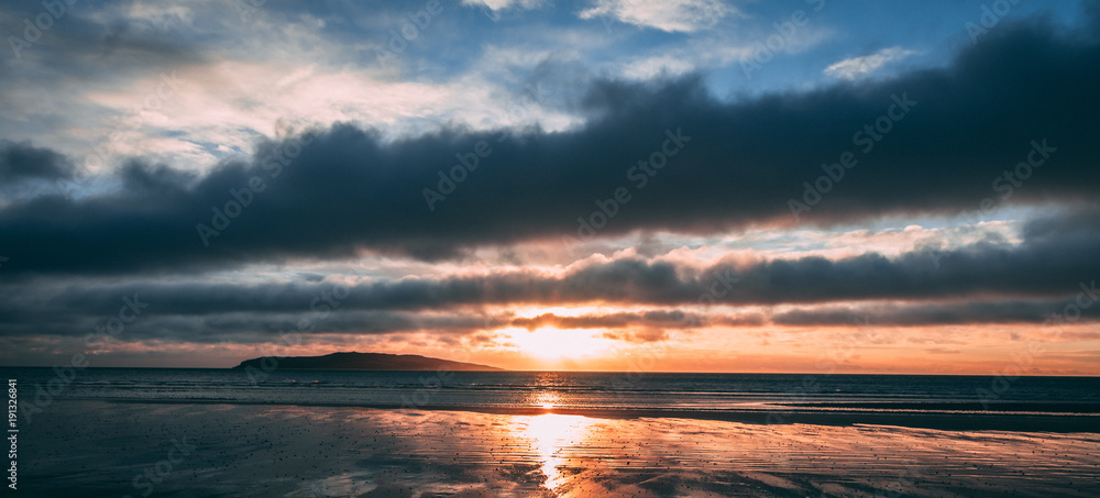 Orange beach sunrise in Rush Ireland
