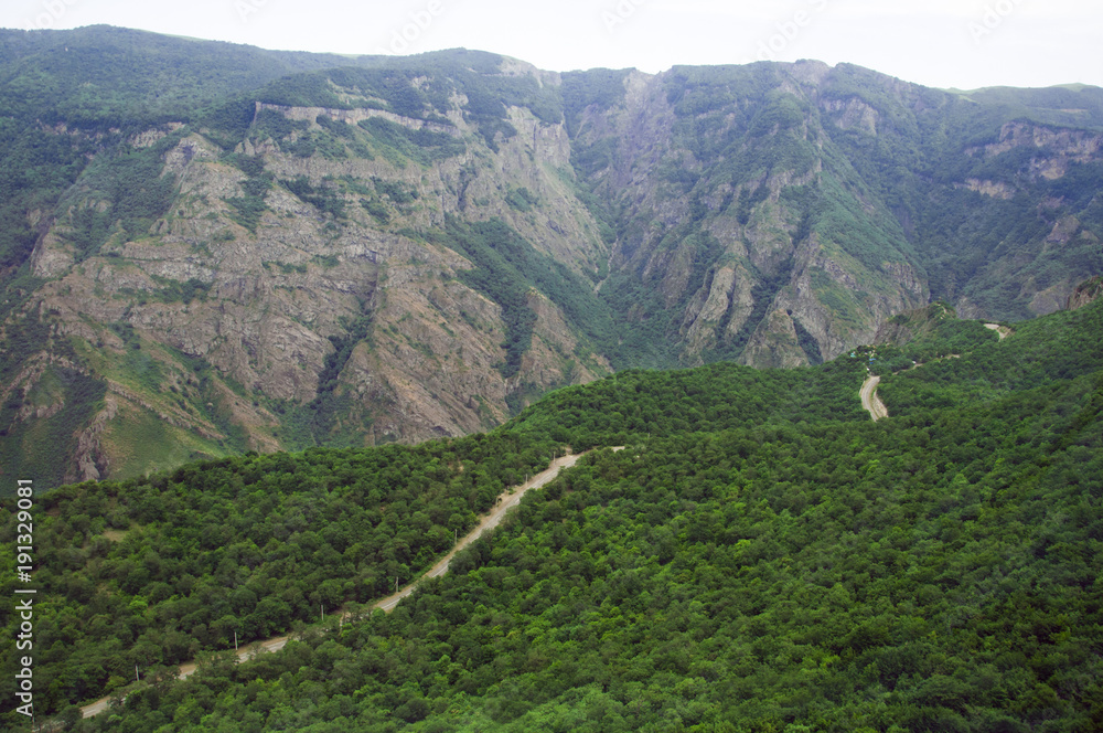 Fototapeta premium Mountain road serpentine through Syunik in Armenia route H45. Top view, landscape, view of the mountains.