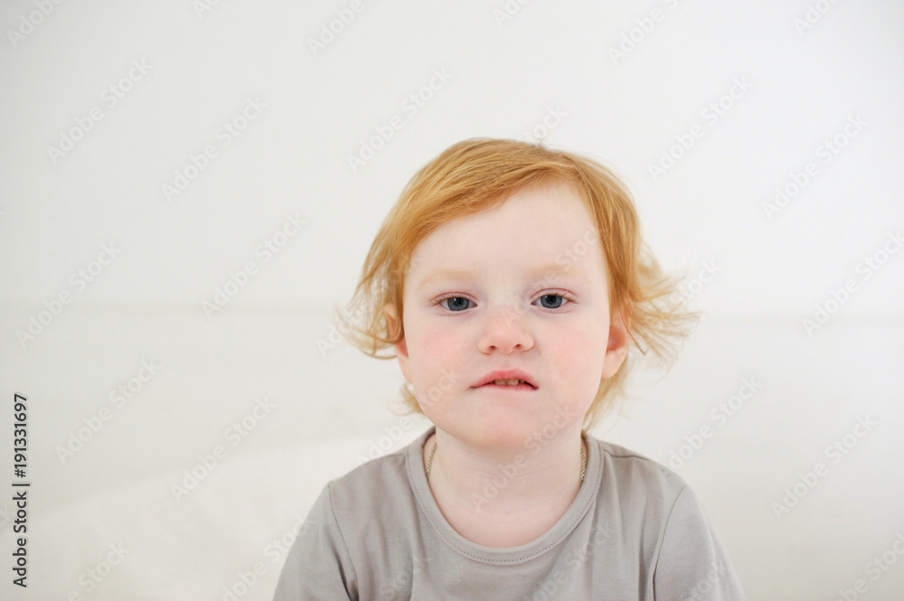 The little girl just woke up on the white background