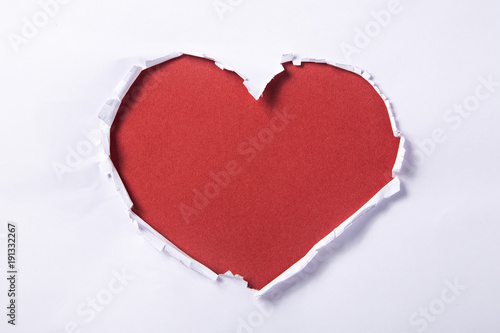 Heart shape hole through paper 