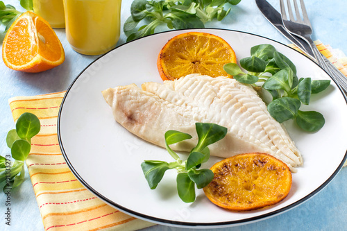 Canvas Print Flounder baked with tangerines