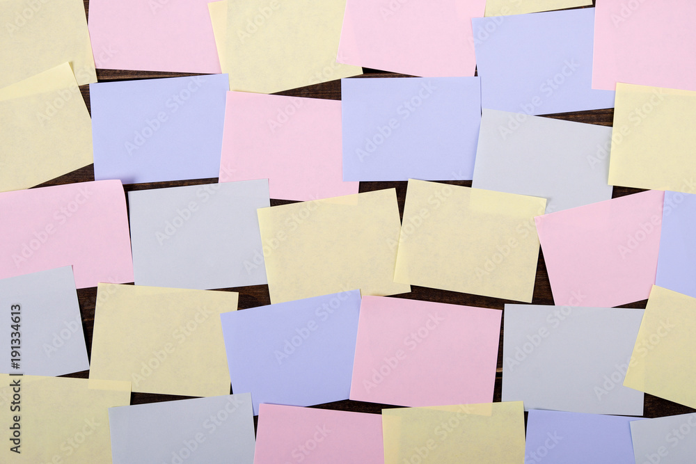 Lots of sticky notes on wall