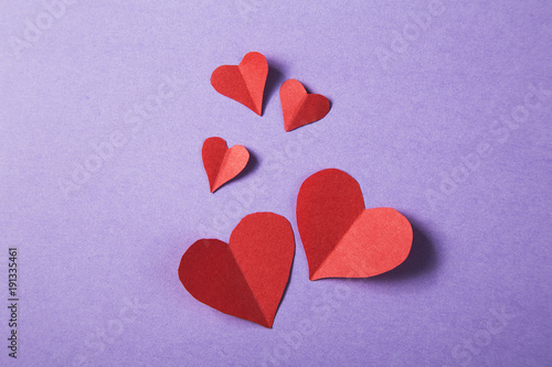 Background of scattered red paper hearts for Valentine's day -