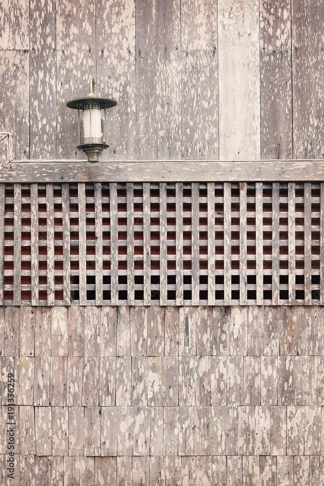 Lamp on wooden wall background Lamp on wooden wall background