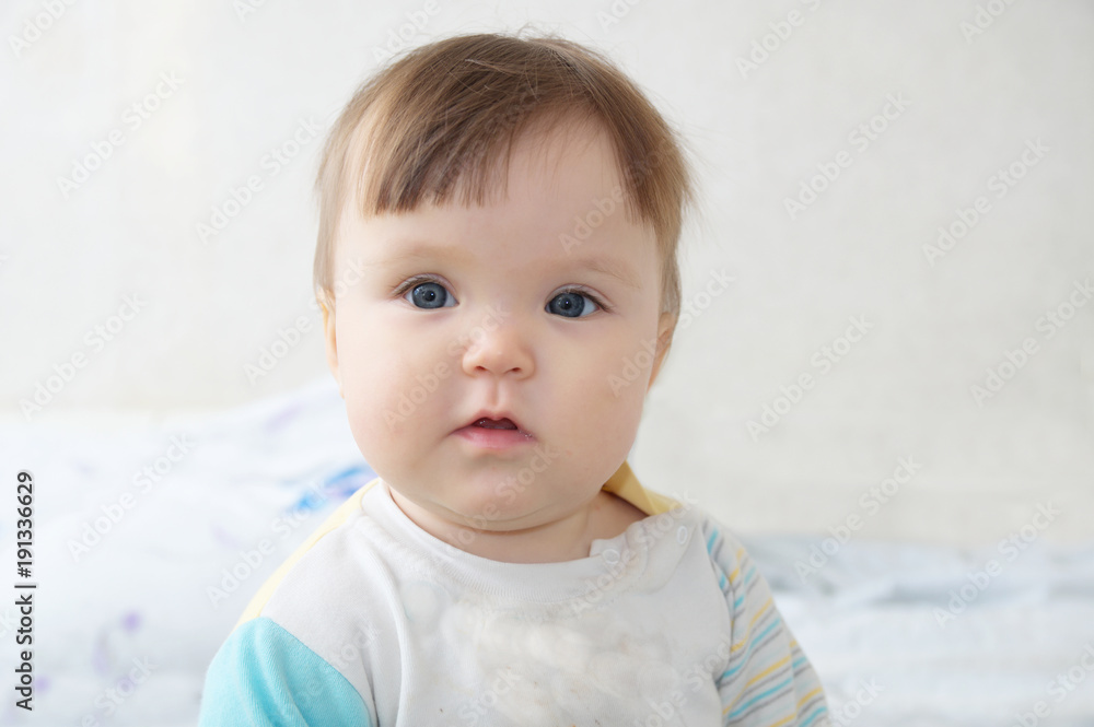 baby portrait, happy infant nine month kid face, little girl looking at camera