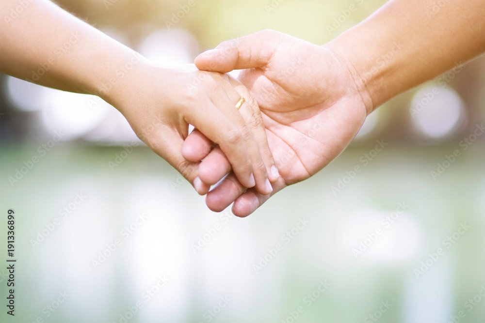 Woman and man holding hands, Happy couple love in the garden. concept couple lover valentine day. Woman and man holding hands, Happy couple love in the garden. concept couple lover valentine day.