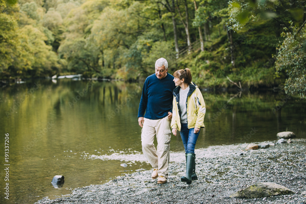 Obraz premium Senior Couple Walking round the Lake District