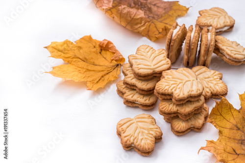 canadian butter cookies with maple syrup on white background