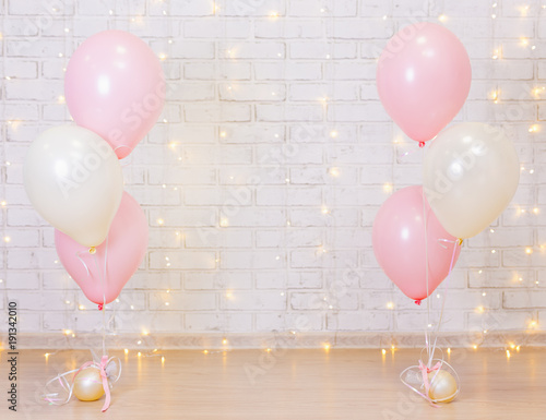 Wall Mural birthday party concept - brick wall background with lights and balloons