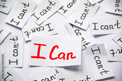 I can. Words of motivation. Concept motivational message of ability and possibility. I can`t and i can are written on peaces of white paper.