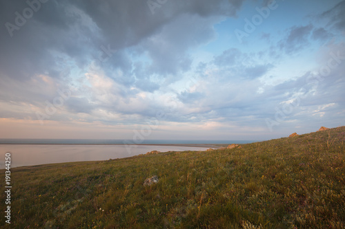 The movement of clouds in the spring in the steppe part of the Crimea peninsula at Cape Opuk.