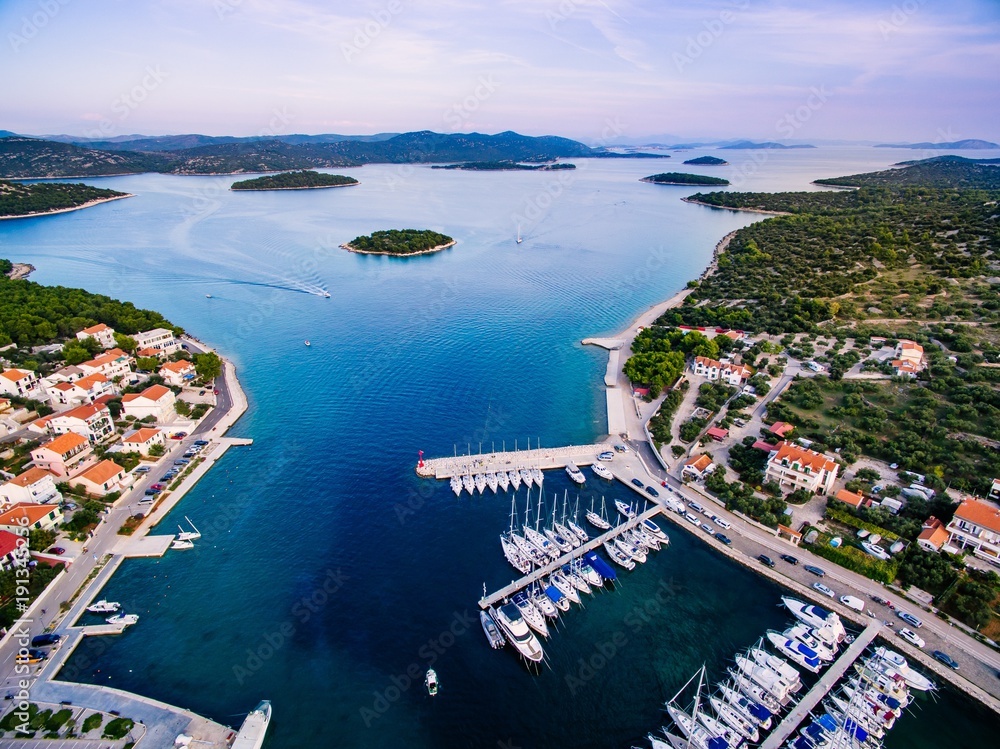 Aerial drone view of small marina with boats and yachts docked in Croatia