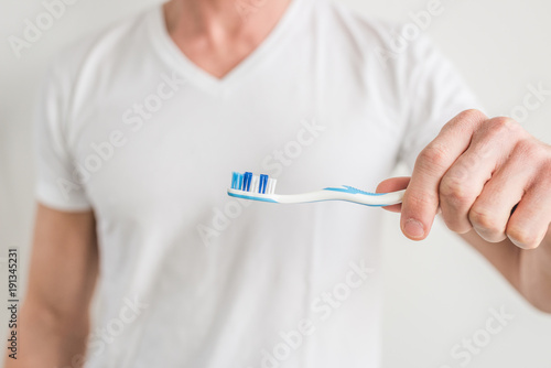 Man using a toothbrush