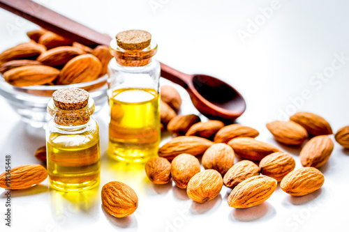 cosmetic set with almond oil on table background