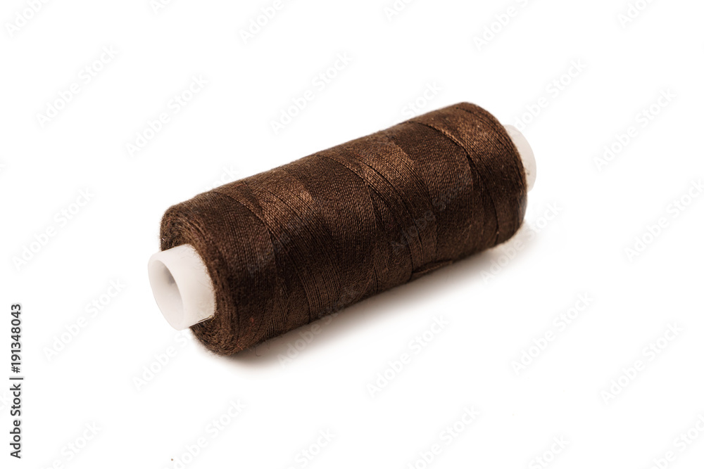 The coil with purple threads isolated on white background. Mult The coil with purple threads isolated on white background. Mult