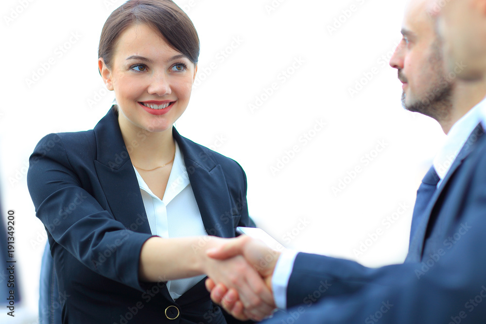 closeup of business woman shaking hands with her colleague. closeup of business woman shaking hands with her colleague.