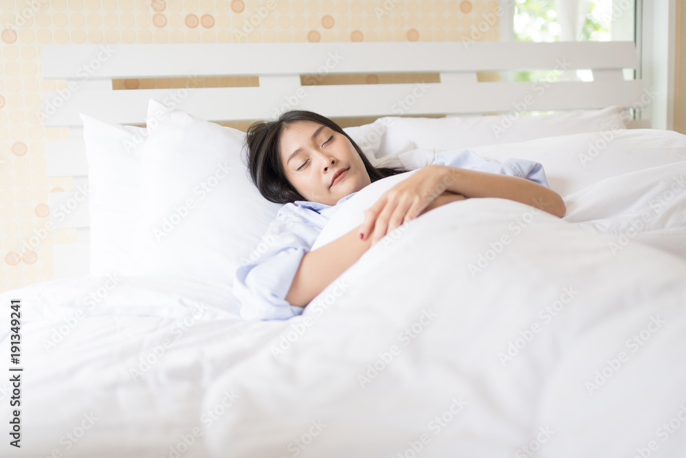 Portrait pretty young girl on bed in modern apartment Portrait pretty young girl on bed in modern apartment