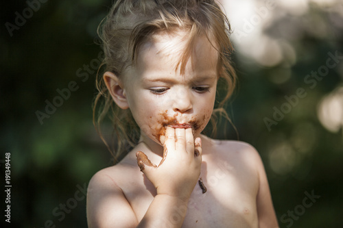 Little Girl Eating Chocolate