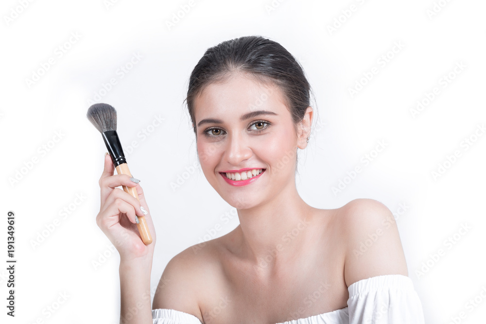 Young beautiful woman with Makeup brush isolated on white backgound Young beautiful woman with Makeup brush isolated on white backgound