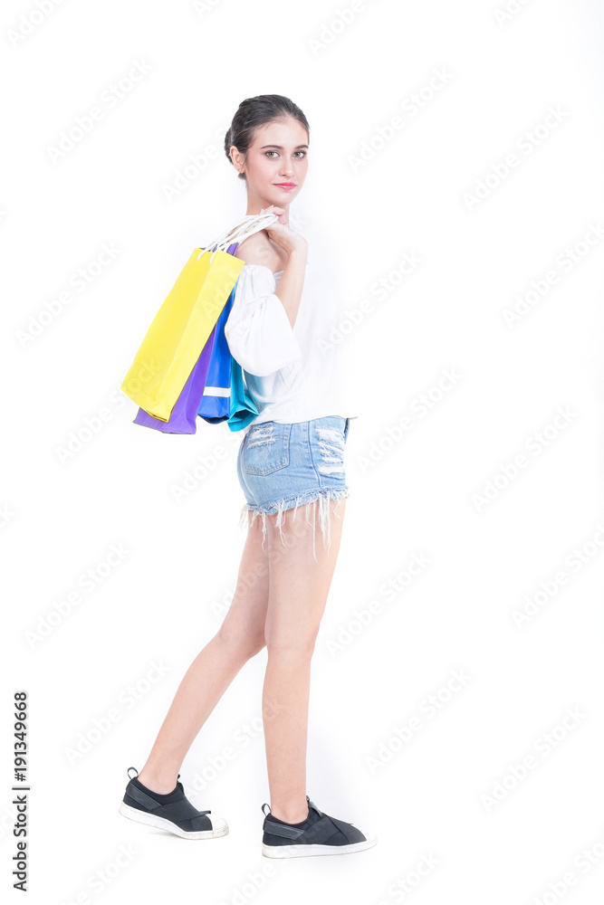 Beautiful woman with a lot of shopping bags isolated on white background.Lover Activity Happiness Lifestyle.Leisure Casual Commercial Shopping Purchase Concept Beautiful woman with a lot of shopping bags isolated on white background.Lover Activity Happiness Lifestyle.Leisure Casual Commercial Shopping Purchase Concept