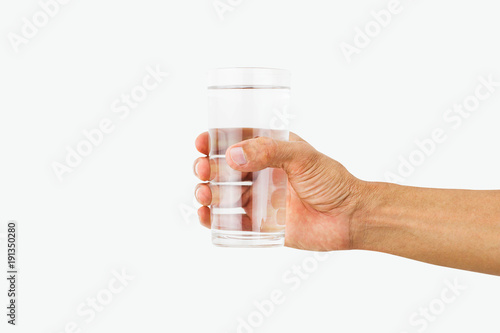 Man hand holding glass of drinking water isolated on white background
