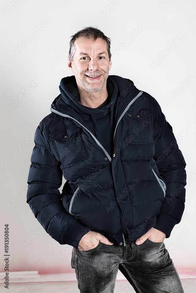 portrait of a forty-five year old man in studio on a white background portrait of a forty-five year old man in studio on a white background