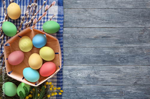 Canvas Print Colorful easter eggs on wood background